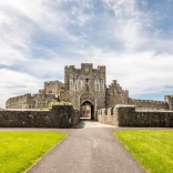 Exterior view of the gate of an old castle.